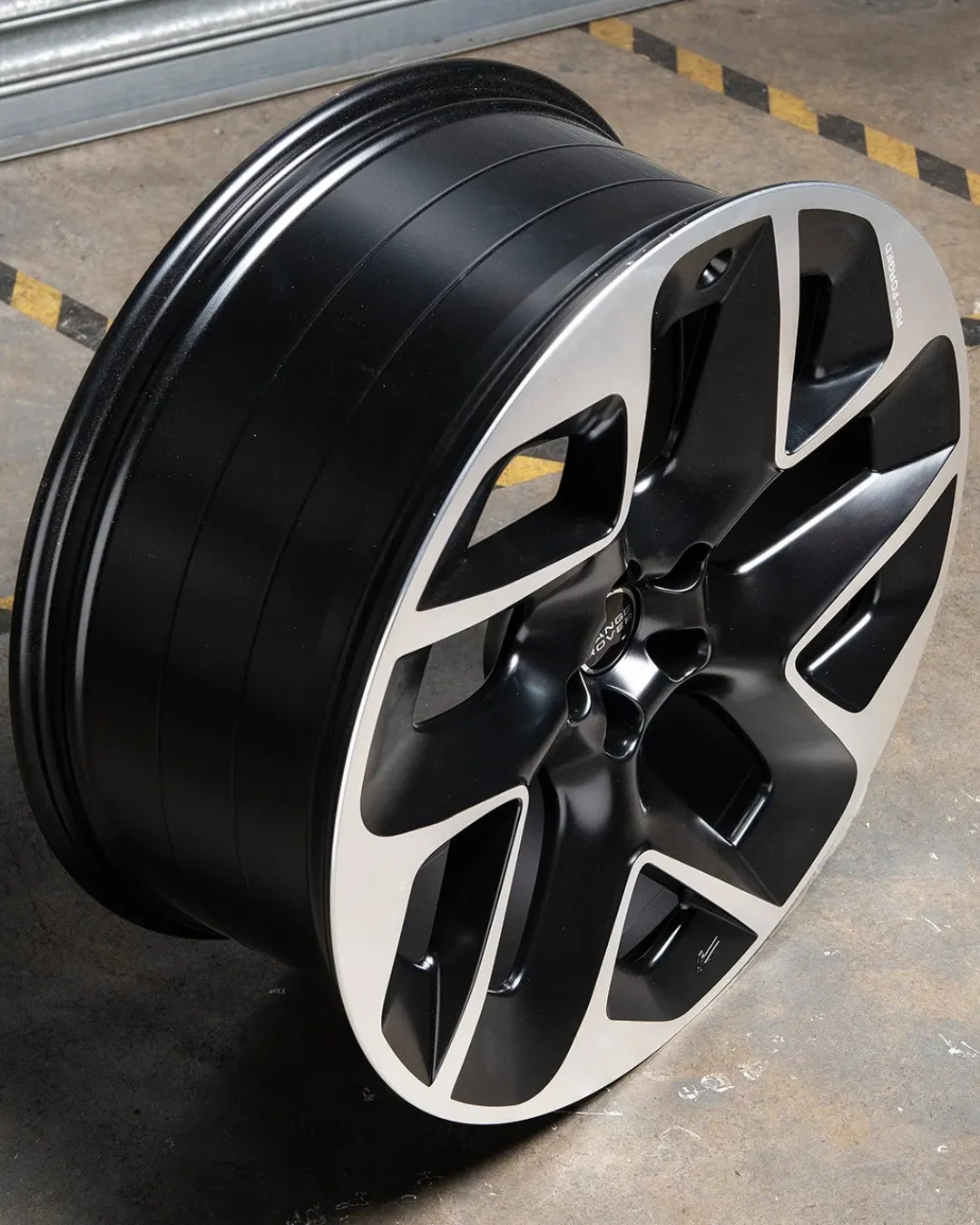 Close view of an alloy wheel rim edge rebuilt and refinished at the Larkhall workshop