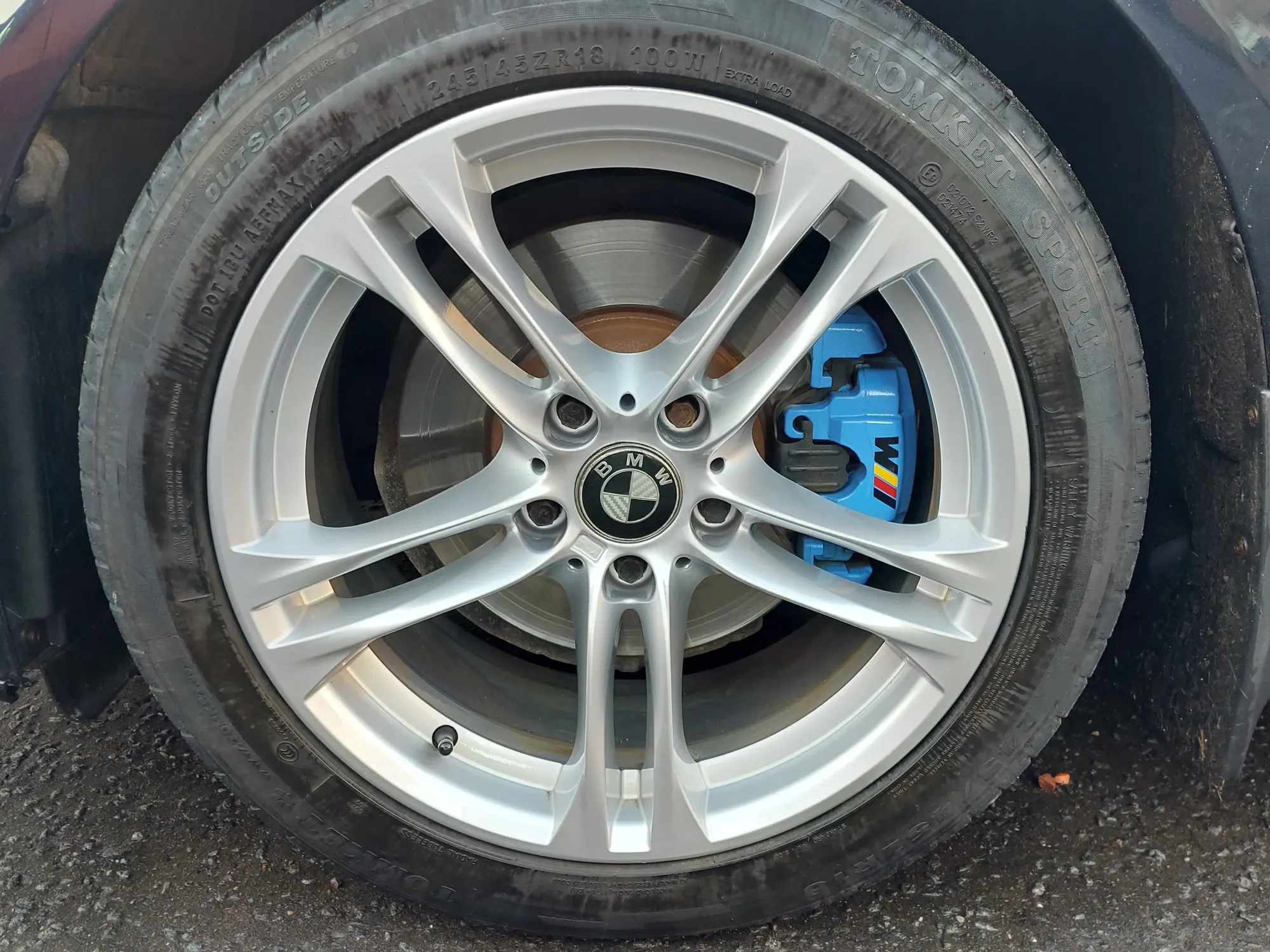 Alloy wheel finished in a custom motorsport colour after refinishing